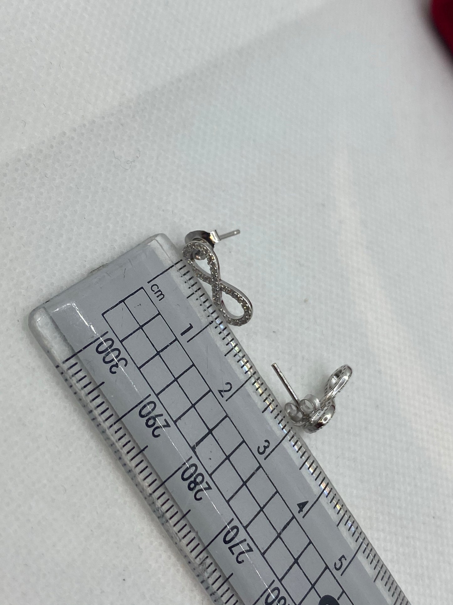 Boucles d'oreilles à tige en argent sterling 925 avec symbole de l'infini