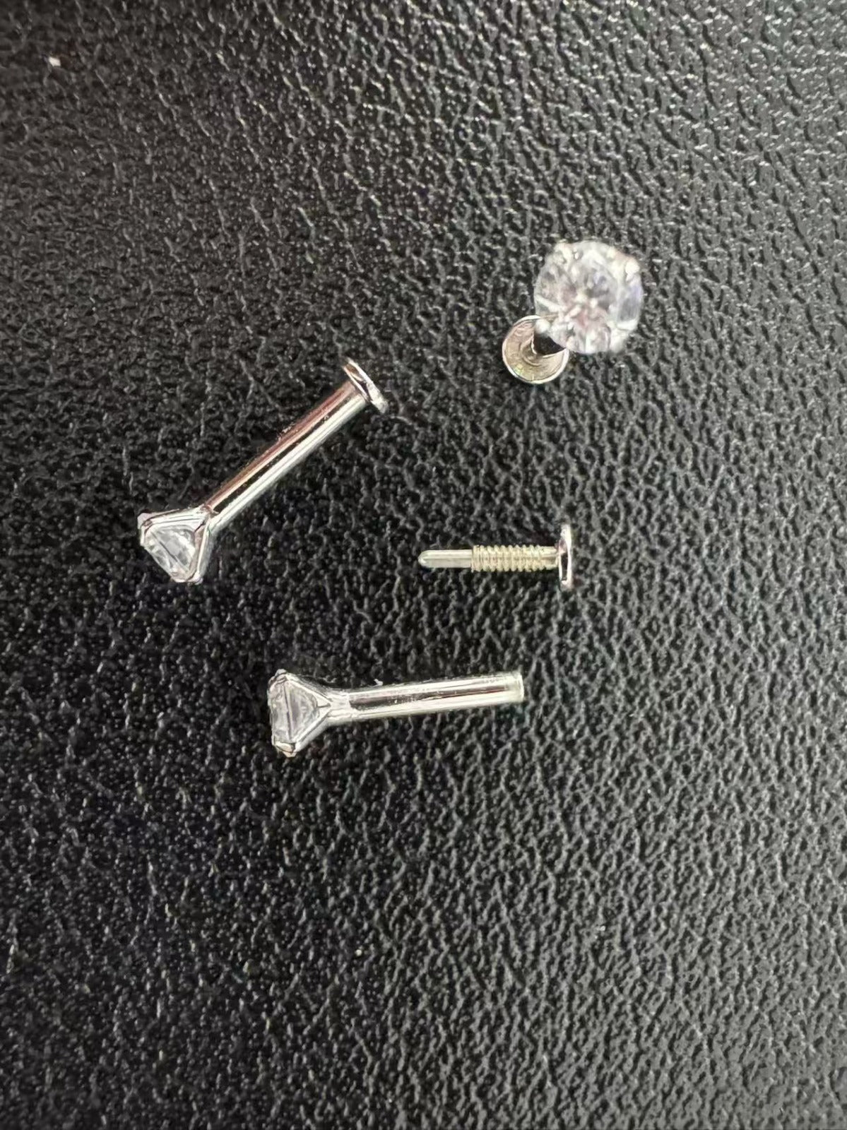 Real silver nose studs with screw back lock.