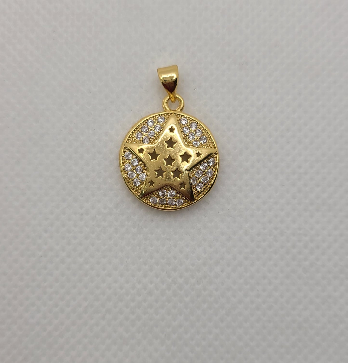 Gold plated star-shaped & star design pendant.