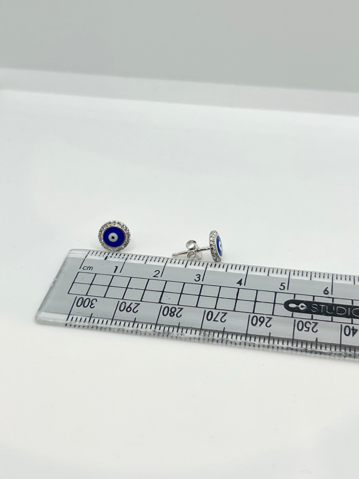 Real silver evil eye round studs